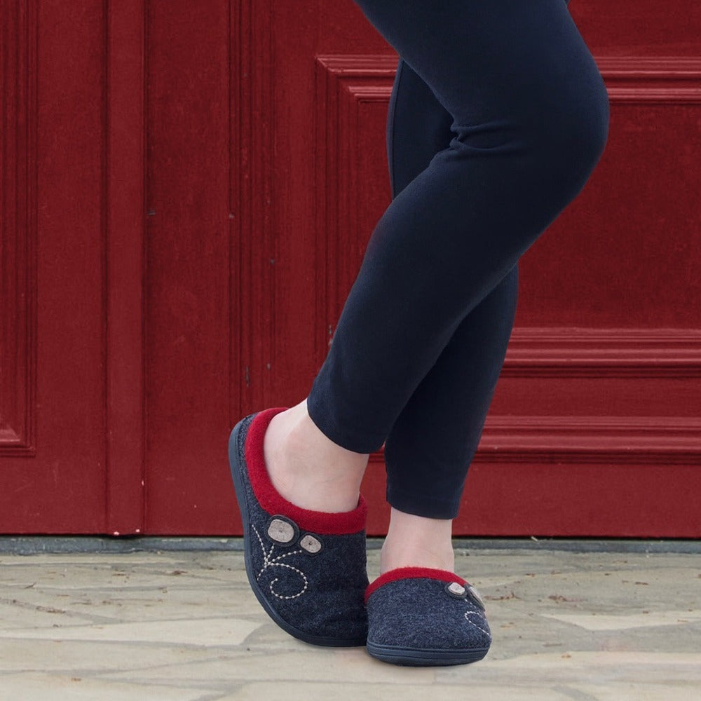 Women's Dara Boiled Wool Slippers in Charcoal Button on Model in Front of a Red Door#color_charcoal-button