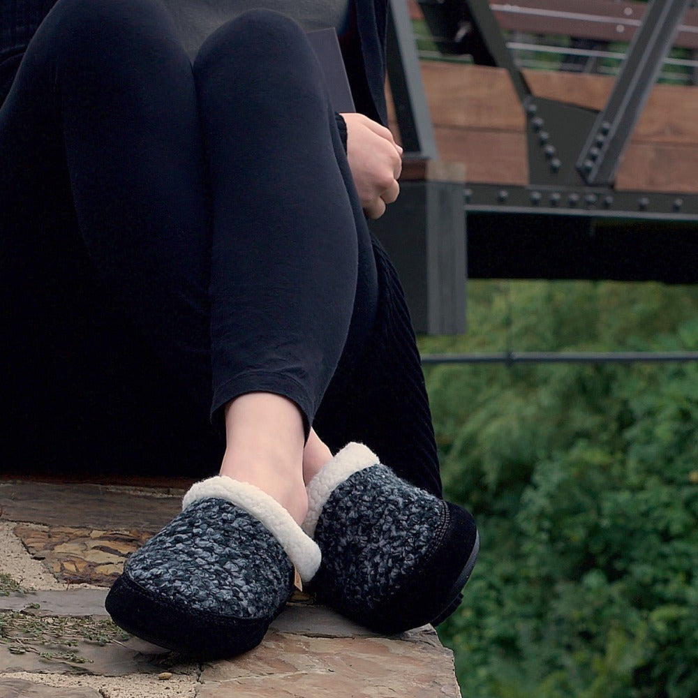 Women's Jam Mule Slippers on figure sitting on ledge of rock by train tracks
