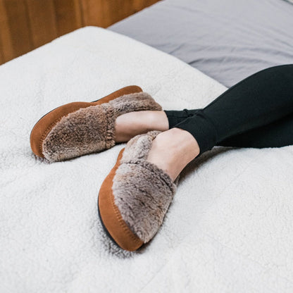 Women's Original Acorn Moccasins iin Brown Berber on Model in Bed#color_brown-berber