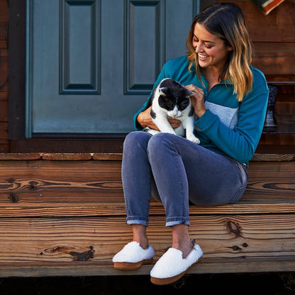 Women’s Lightweight Bristol Loafer in Buff Popcorn on model sitting on the stairs of a porch holding a cat #color_pebble