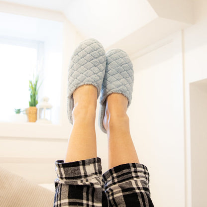 Women's Spa Quilted Clog in Powder Blue on figure with the model's feet in the air#color_powder-blue